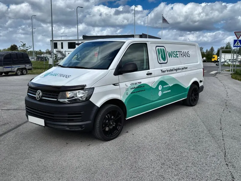 WiseTrans courier van in front of an office building